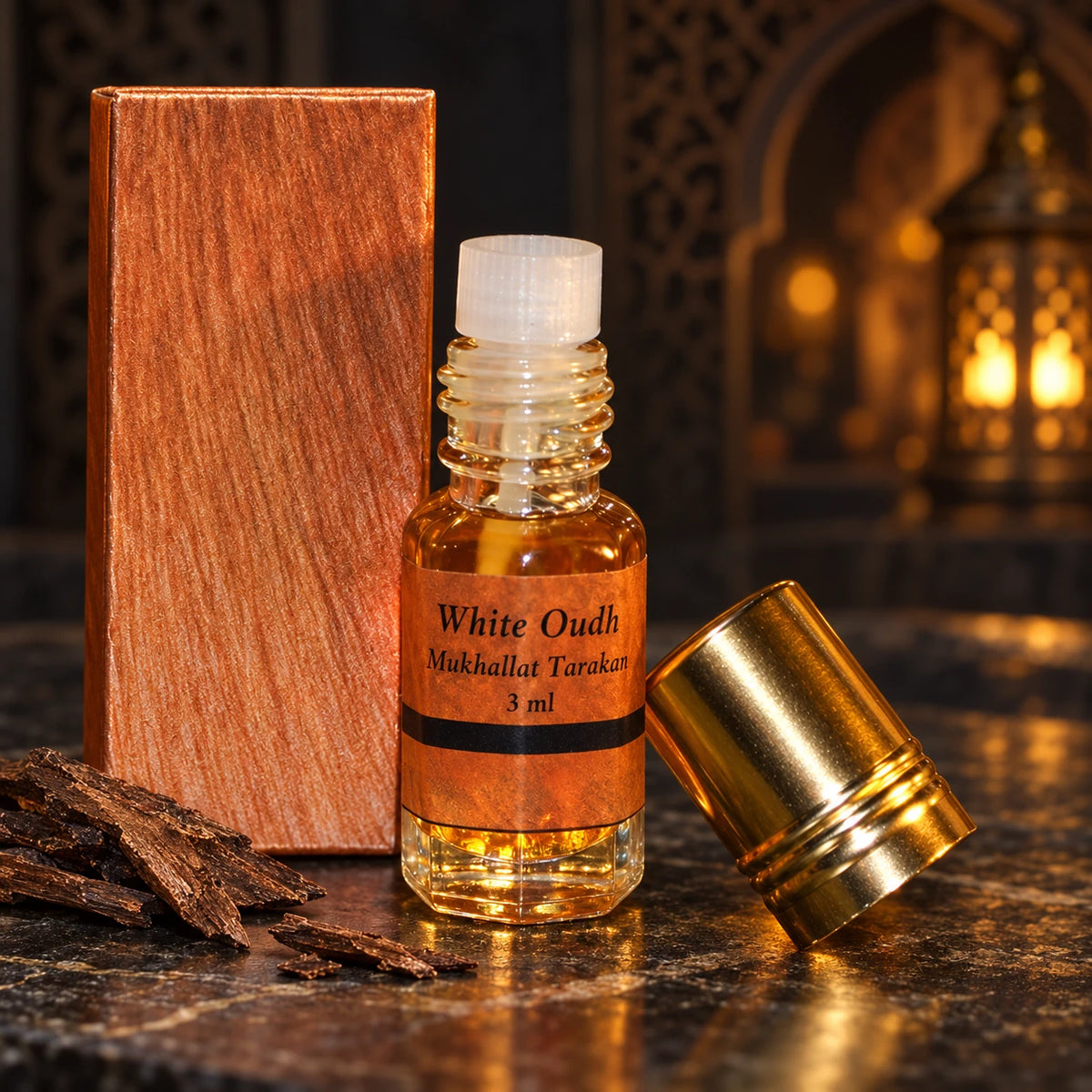 White Oudh Tarakan – Agarwood Mukhallat 3ml labelled bottle and original box in a dark oriental setting