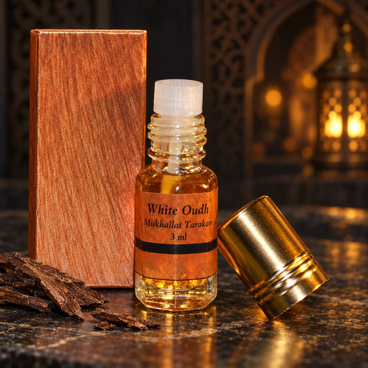White Oudh Tarakan – Agarwood Mukhallat 3ml labelled bottle and original box in a dark oriental setting